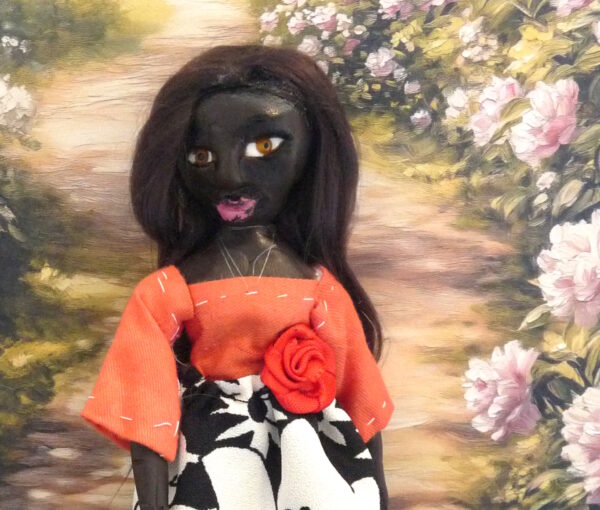 Tanja - Doll with orange and blackandwhite dress